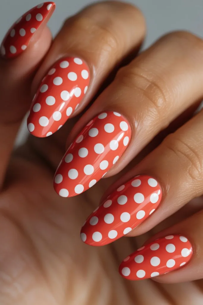 These retro-inspired white-on-red dots are classic polka dot nail ideas with a playful twist.